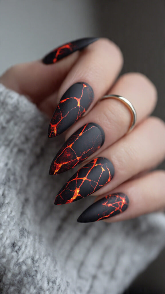 20 Spooky Nails to Try This Halloween: Creepy, Cute, and Stylish Ideas 11 10 matte stiletto nails with lava glow