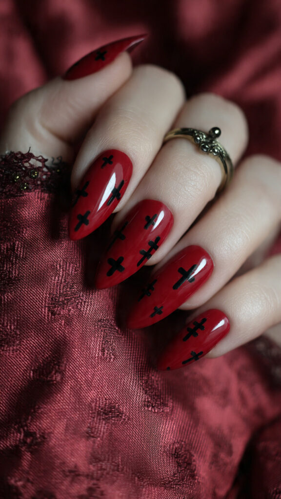 29 Vampire Nails That Are Dark, Chic, and Perfect for Halloween 6 crimson almond nails with black crosses pin