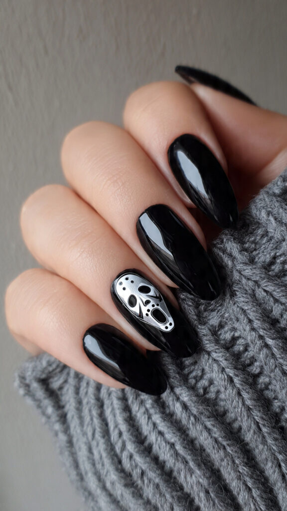 Glossy Black Nails With a Jason Mask Accent