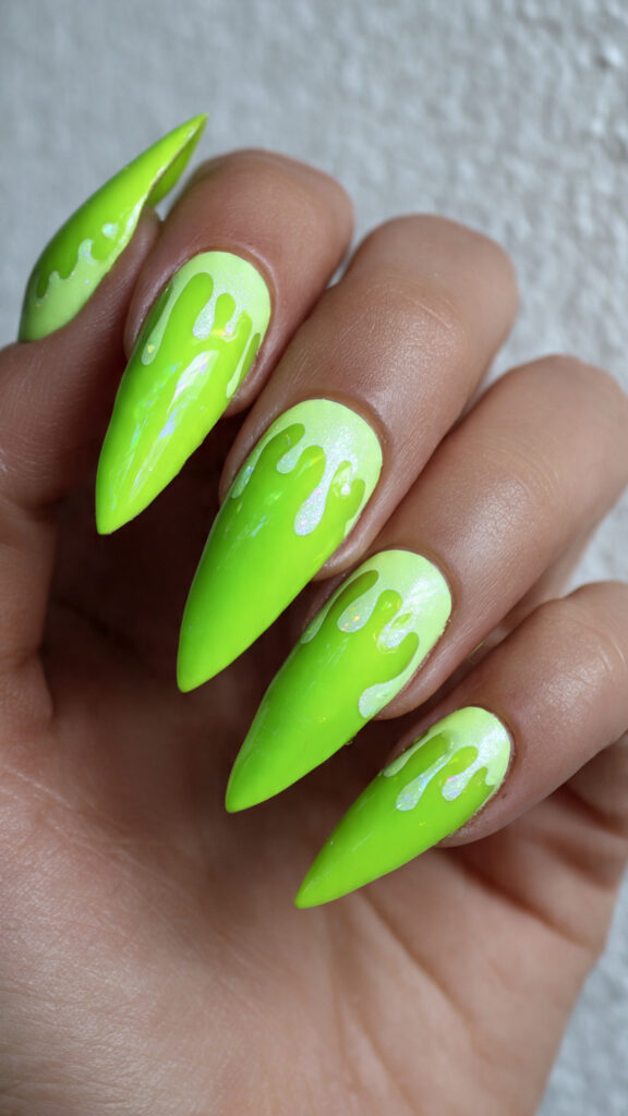 neon green dripping over sharp stiletto nails