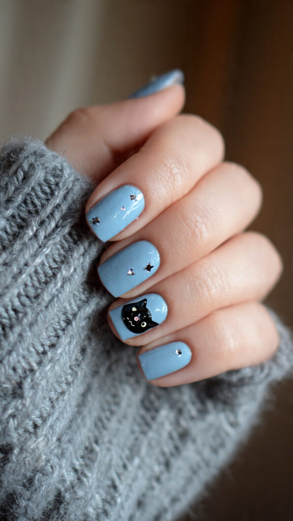 Soft Blue Nails With Black Cat Accent