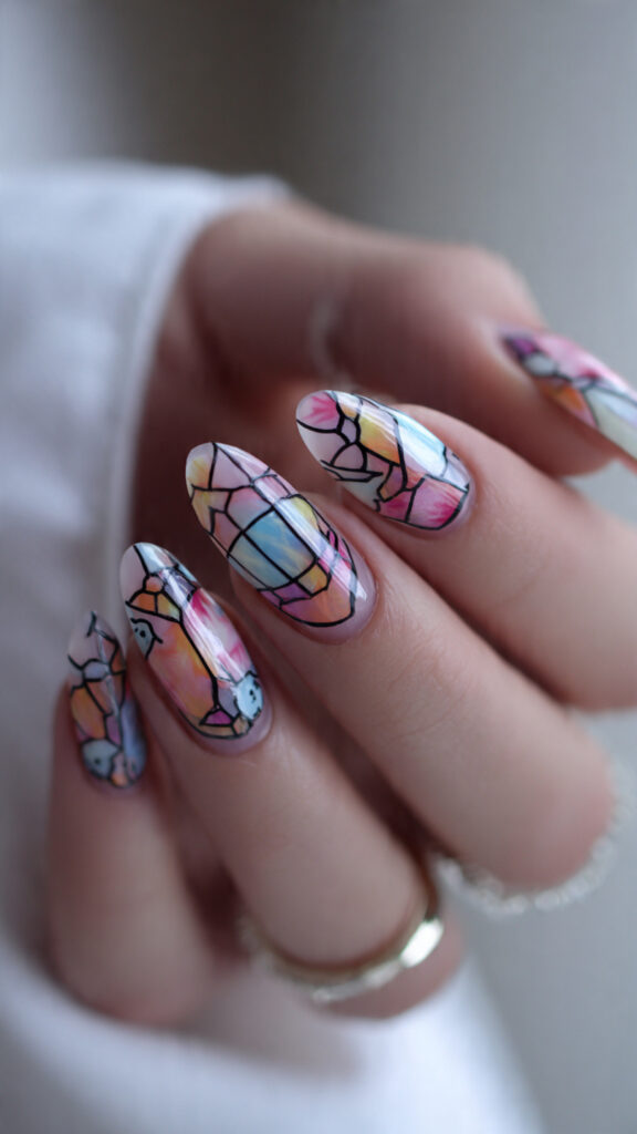 20 Spooky Nails to Try This Halloween: Creepy, Cute, and Stylish Ideas 13 stained glass almond nails with ghost and