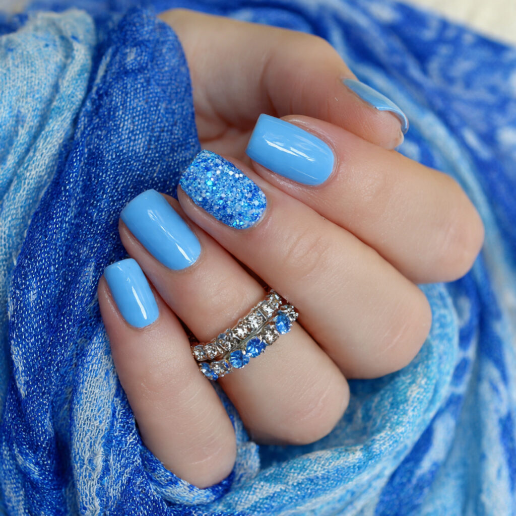 10 blue january nails with single accent