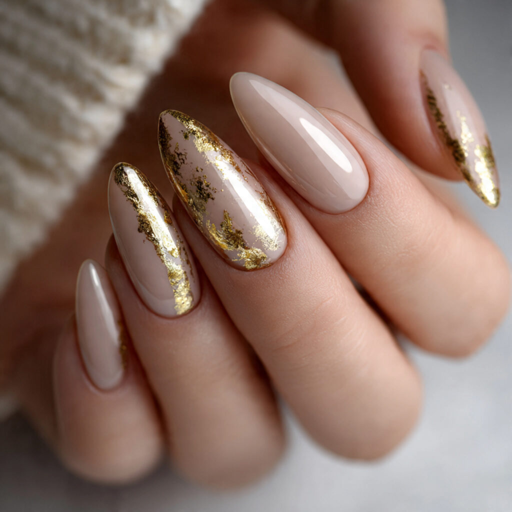 a close up of elegant almond shaped nails featuring 1