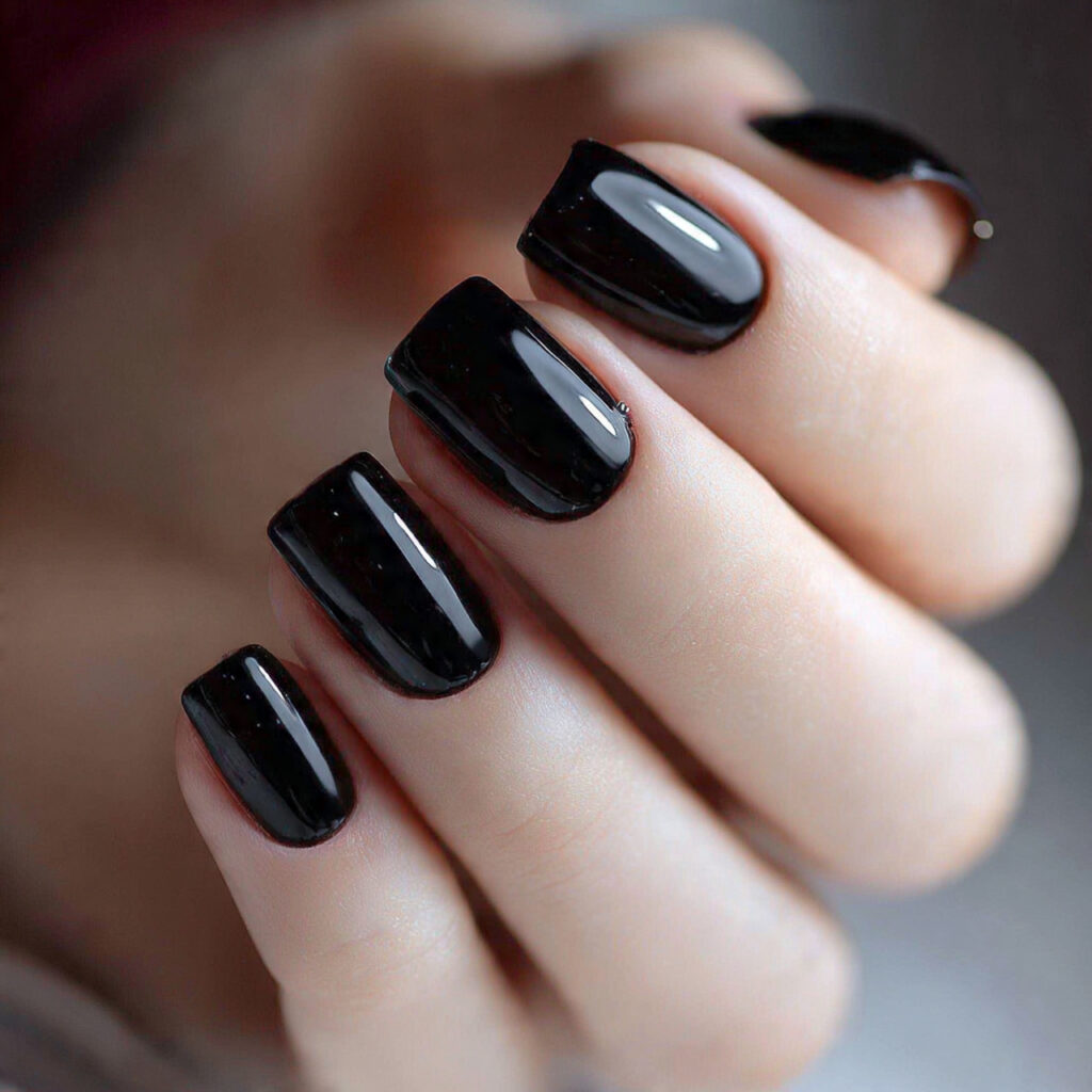 glossy black nails look bold and classy