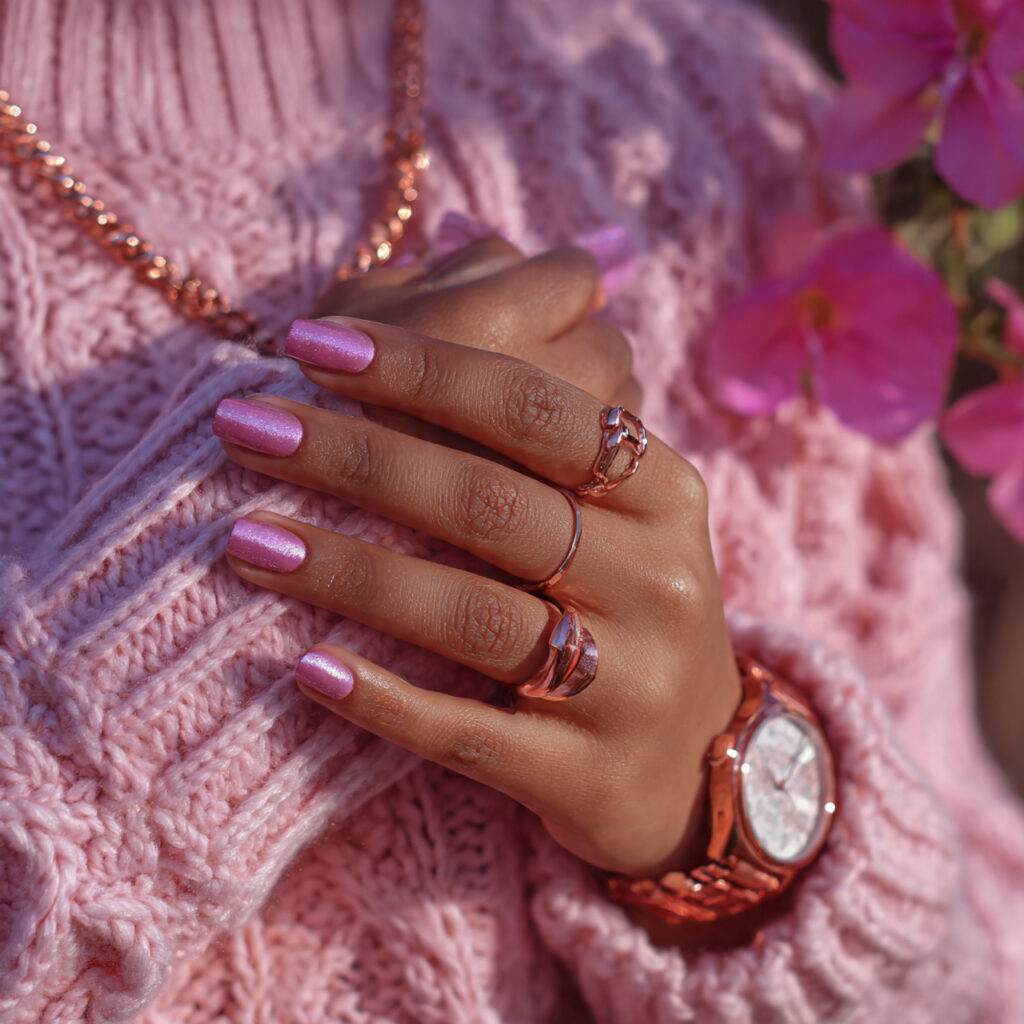 a person wearing pink clothing and rose