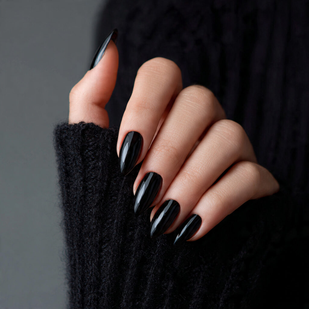25 Leo Nail Ideas That Are Bold, Glam, and Confident 5 a person with bold and confident black