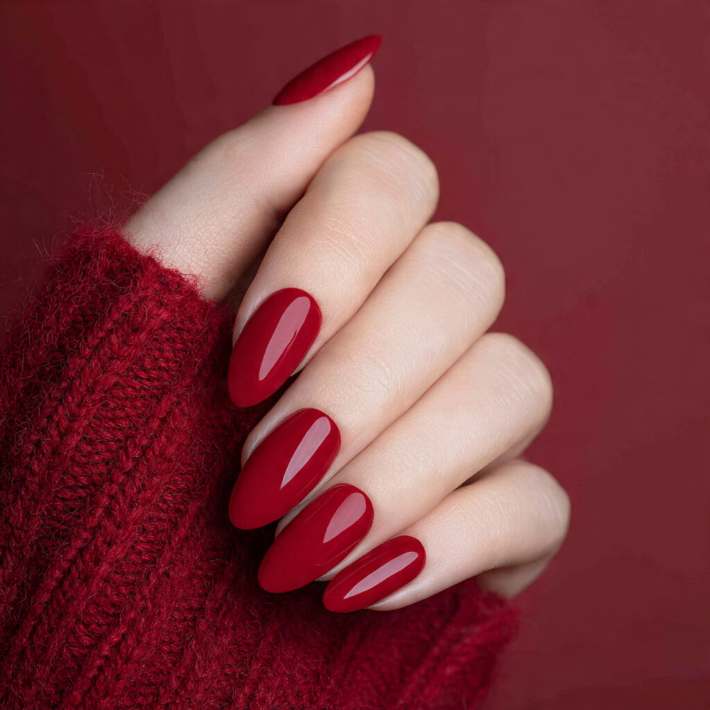 a woman s hands with long nails painted