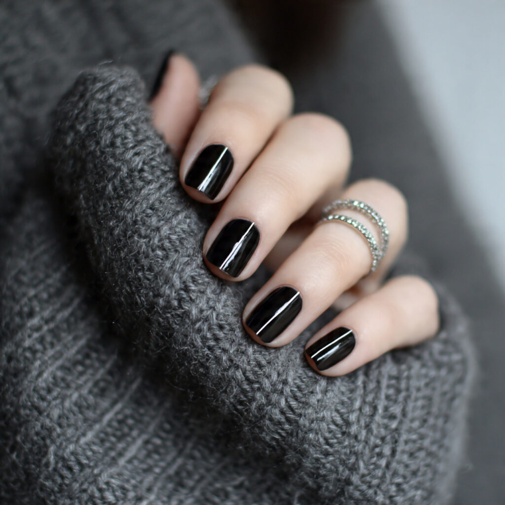25 Black Nail Ideas That Look Bold, Chic, and Timeless 14 black nails with minimal line designs add