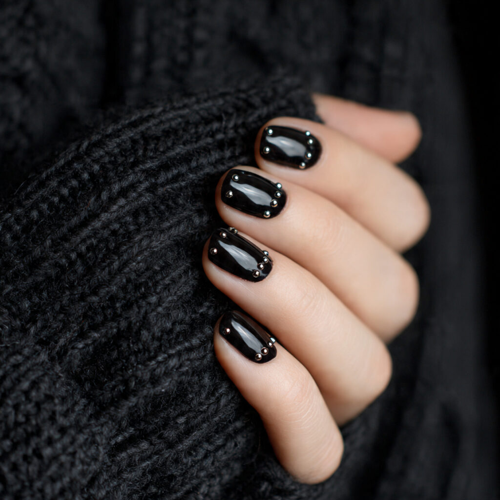 25 Black Nail Ideas That Look Bold, Chic, and Timeless 17 black nails with minimal stud details add
