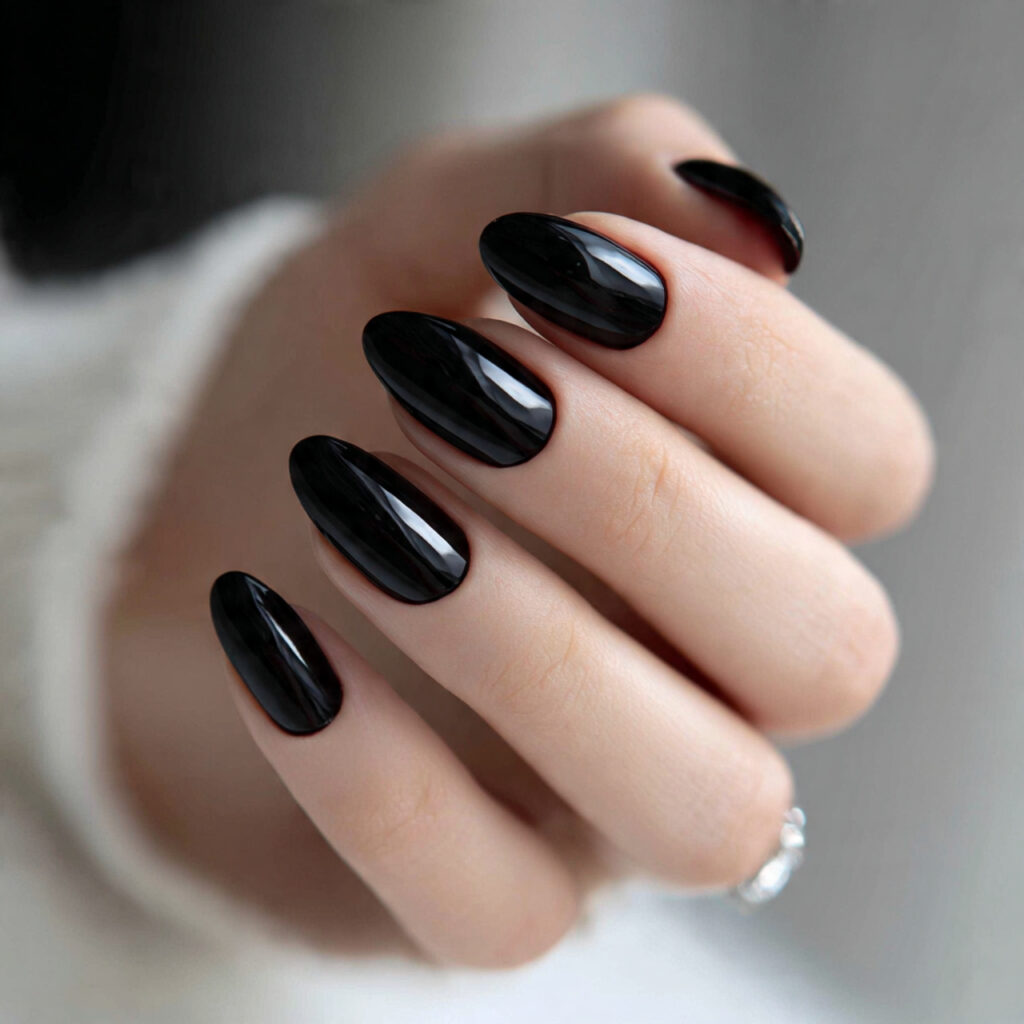 25 Black Nail Ideas That Look Bold, Chic, and Timeless 18 black short oval nails combine softness with
