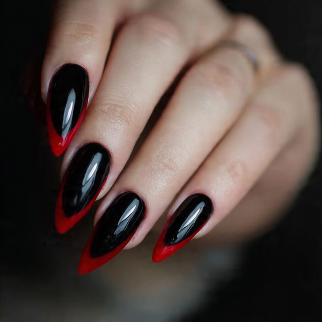 black stiletto nails with red tips create