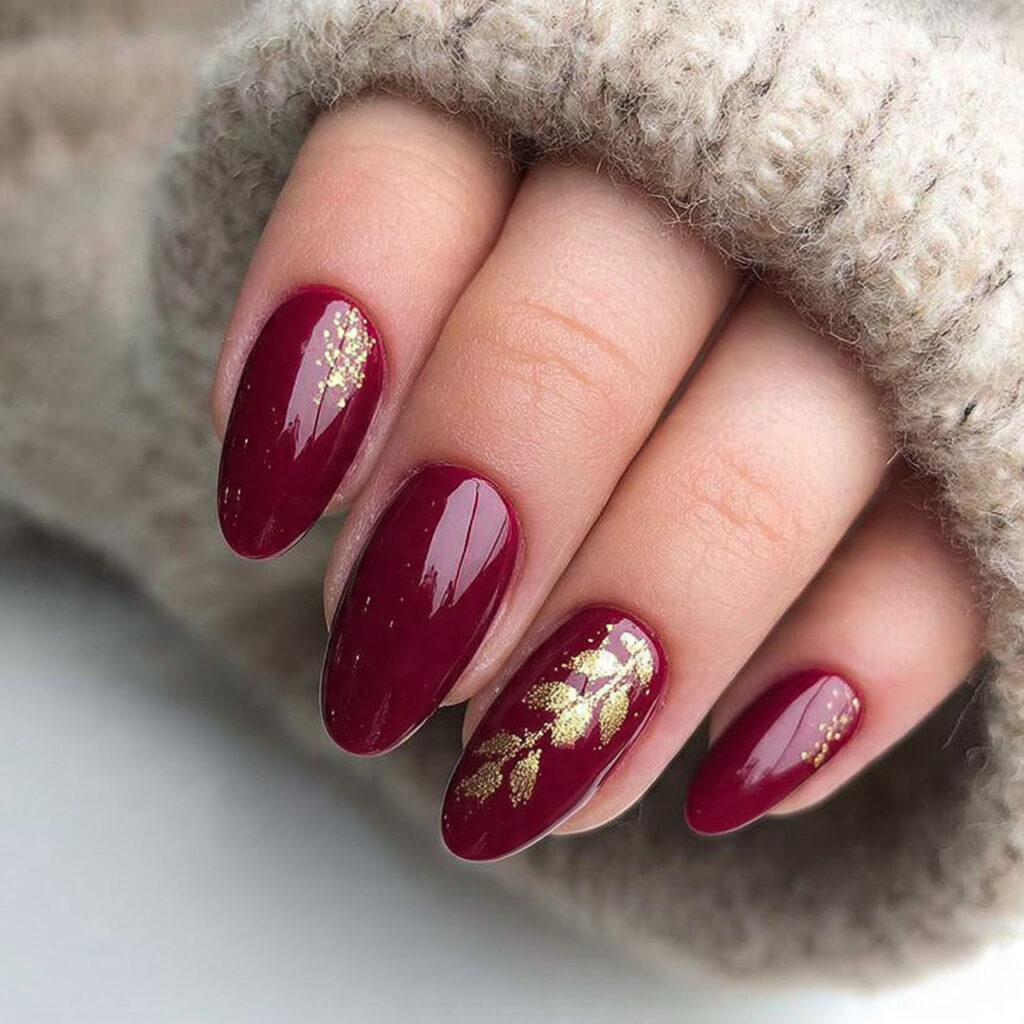 burgundy nails with gold accents