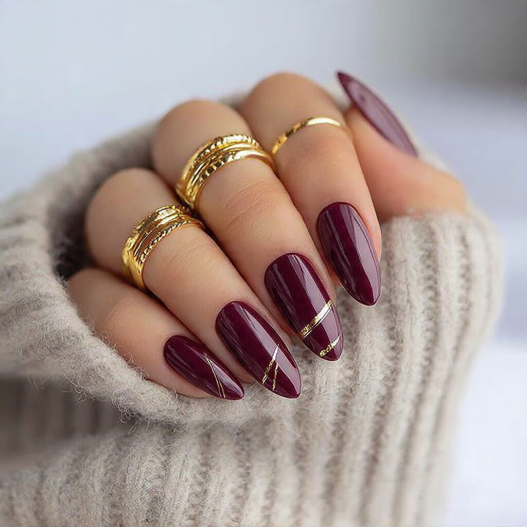 burgundy nails with minimal line art feel