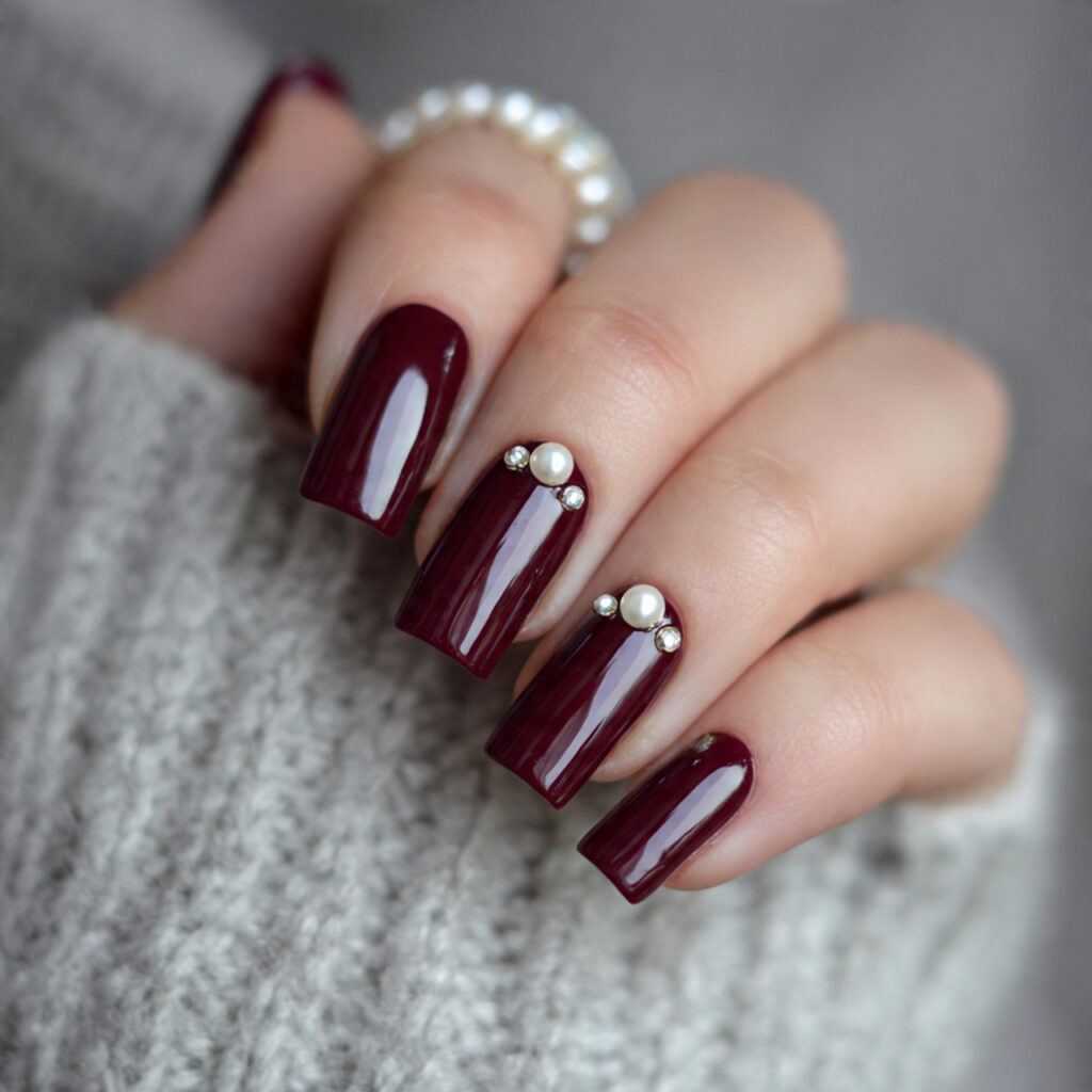 burgundy nails with pearl accents