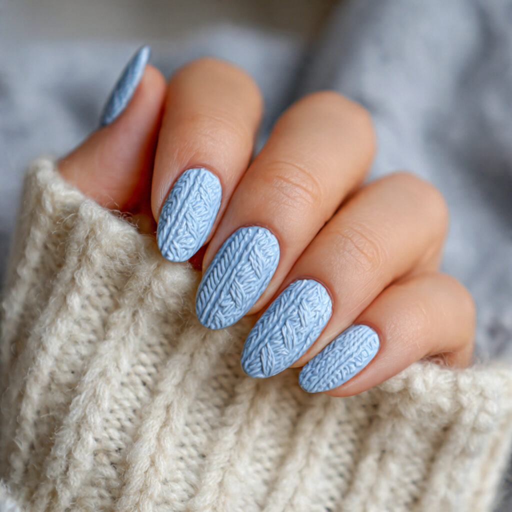 cozy soft blue january nails with sweater