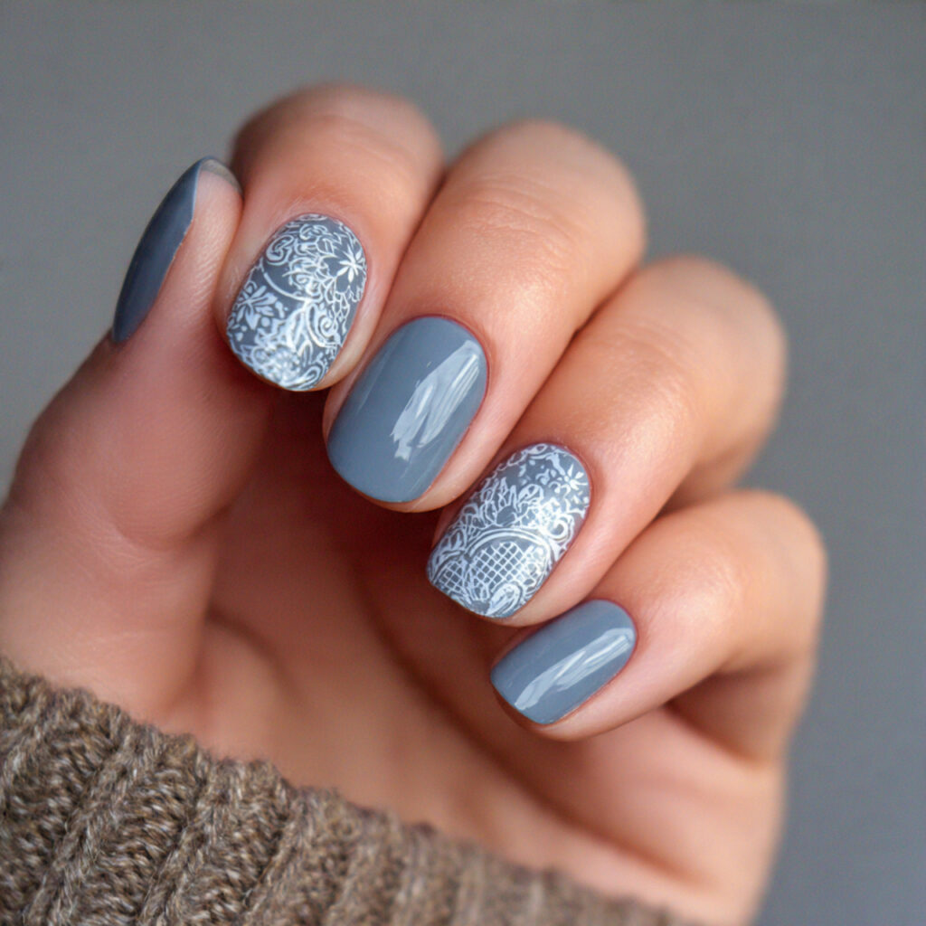 dusty blue nails featuring delicate lace patterns