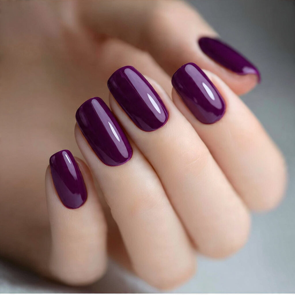 glossy purple nails create a rich and