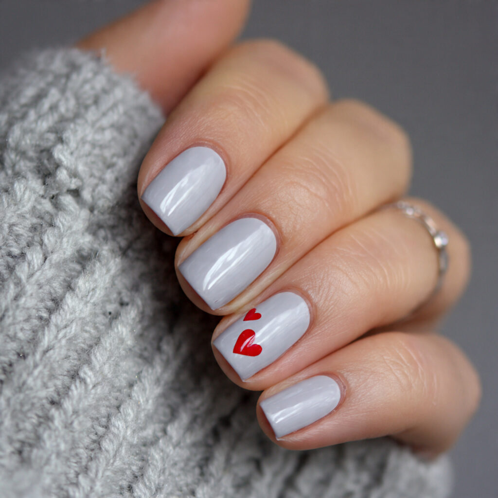 light gray nails with cute heart detail