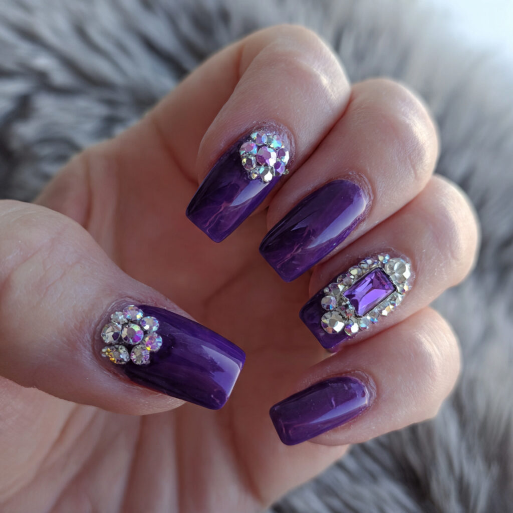 purple nails with rhinestone details