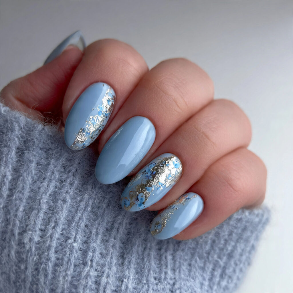 soft blue january nails with silver foil