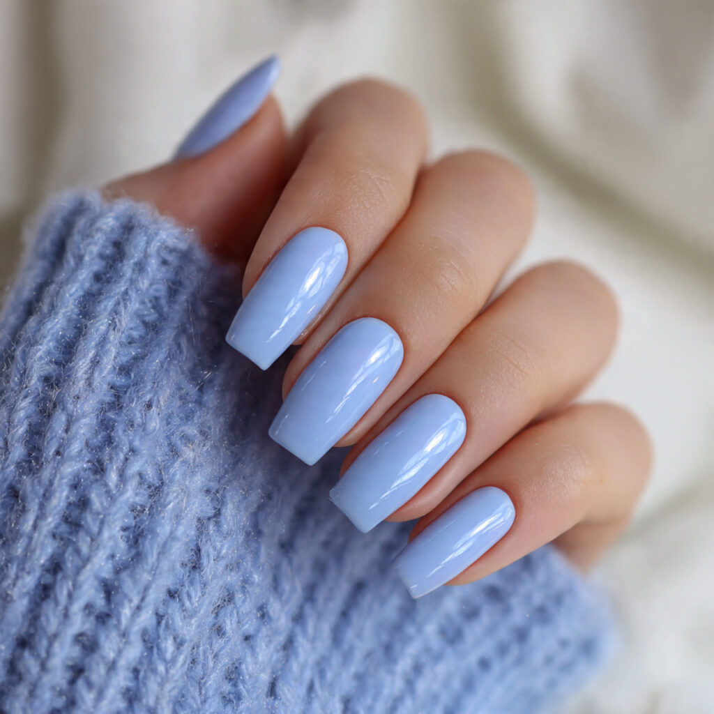 soft blue nails with glossy finishes