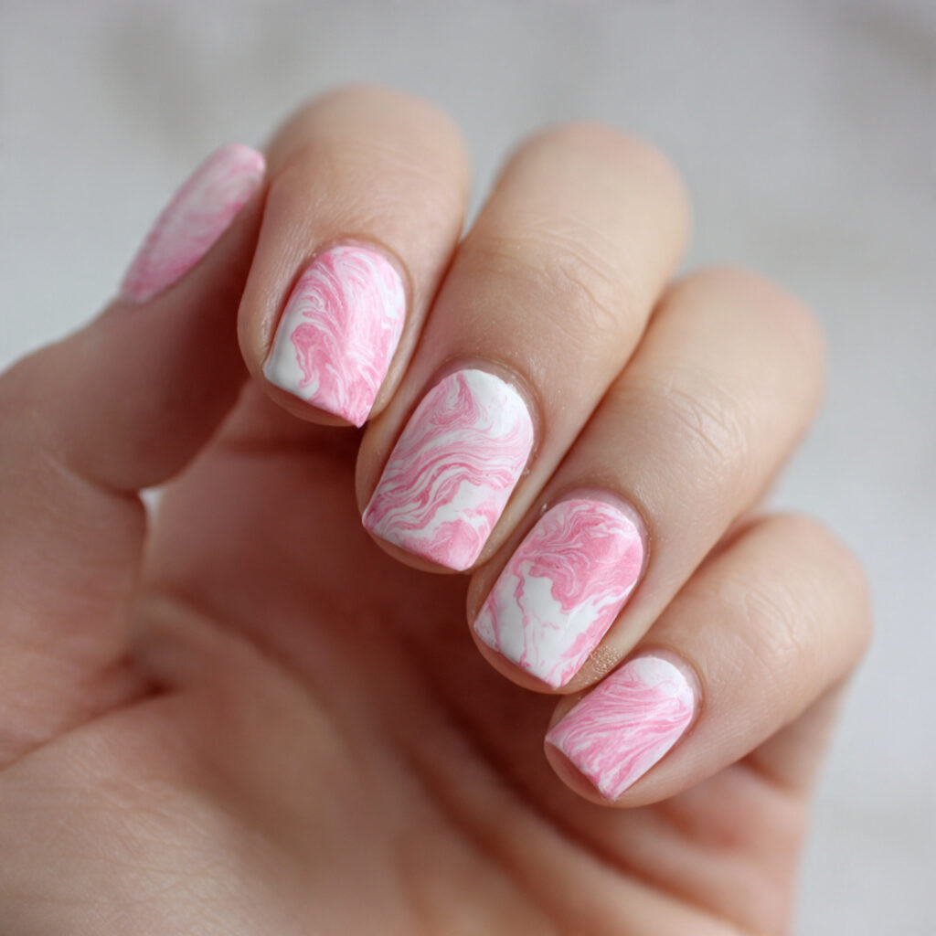 marble nails by swirling pink and white
