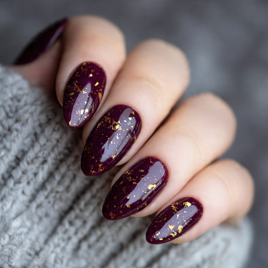 rich deep plum nails with scattered gold