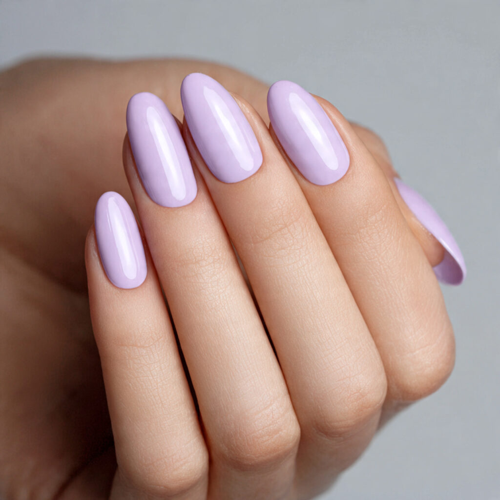 short rounded nails painted gentle lavender creamy